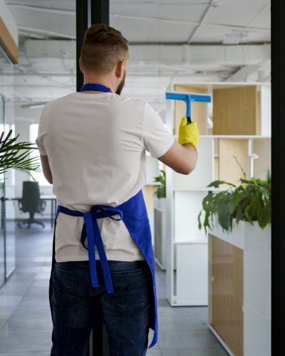 professional-cleaning-service-person-cleaning-office-window